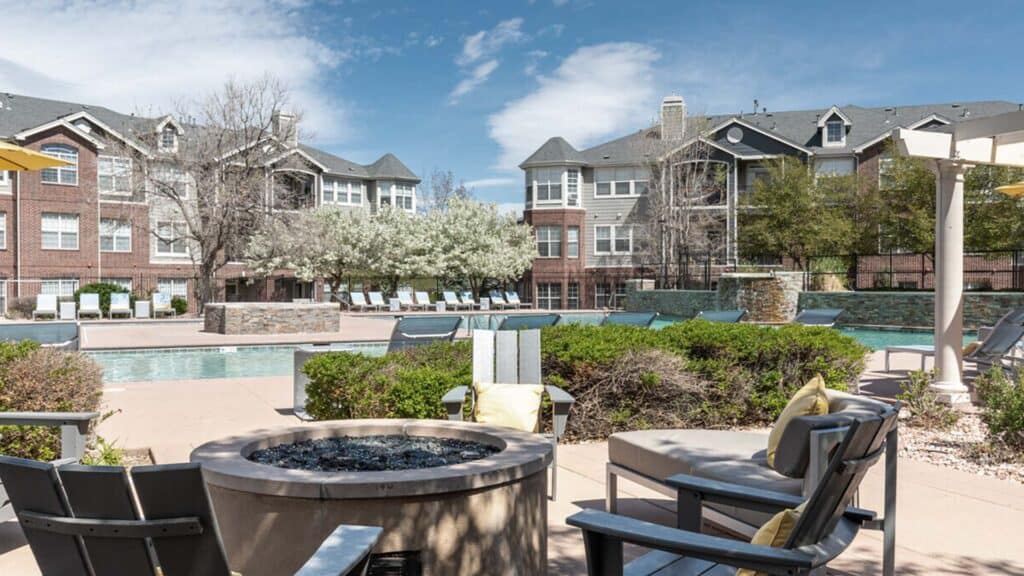 Modern residential apartment complex with outdoor pool and lounge area at Hibernia Housing.
