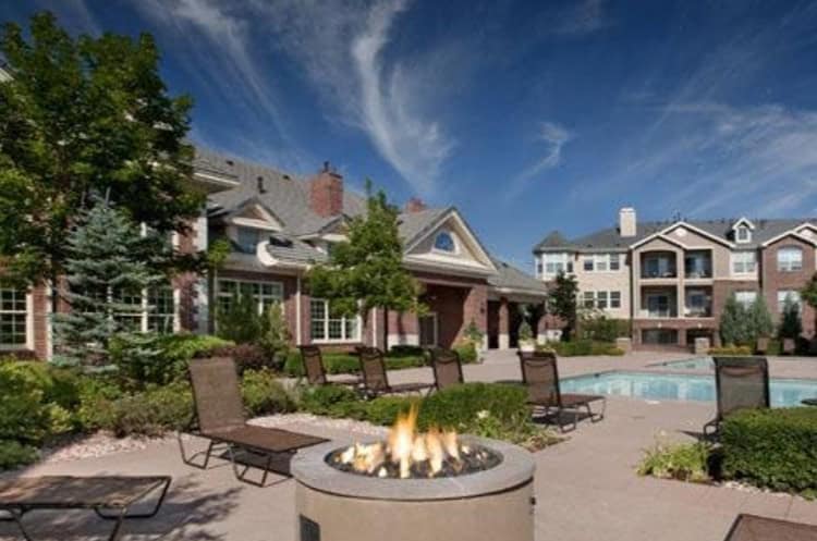 Modern apartment complex with outdoor pool and fire pit at Hibernia Housing.